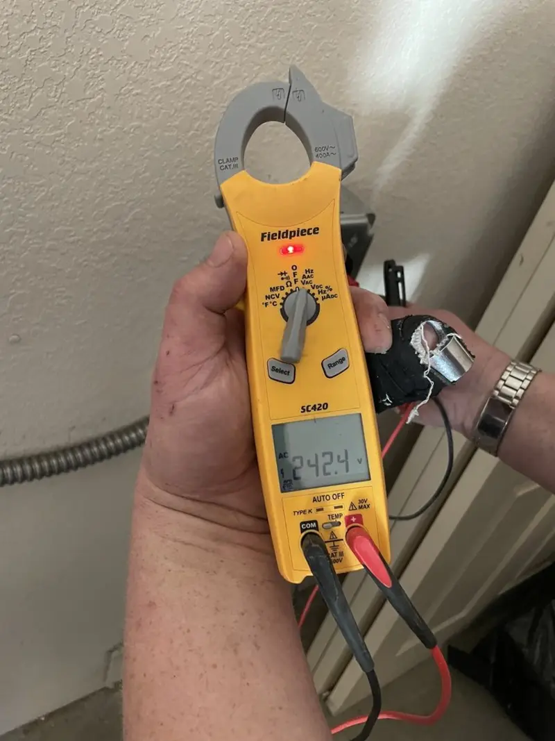 Voltage testing with clamp meter during Electrical Installation Services in Woodlawn Beach
